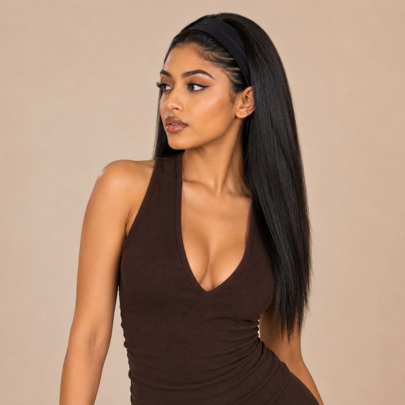 Model wearing a natural black yaki straight human hair headband wig, front view