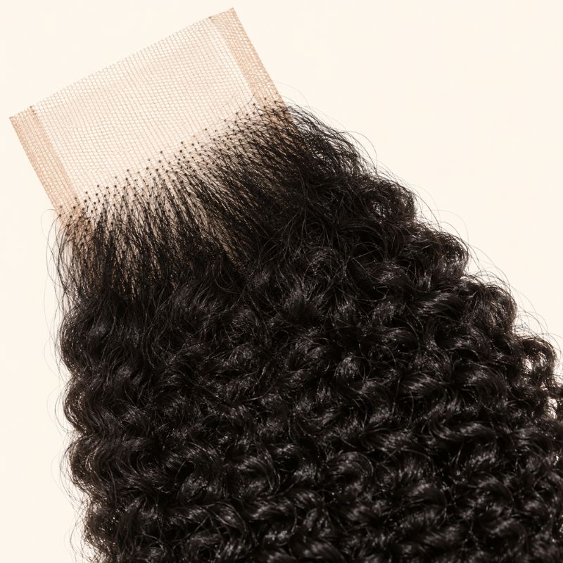 Close-up of the HD lace and parting on a Afro kinky curly 2x6 closure