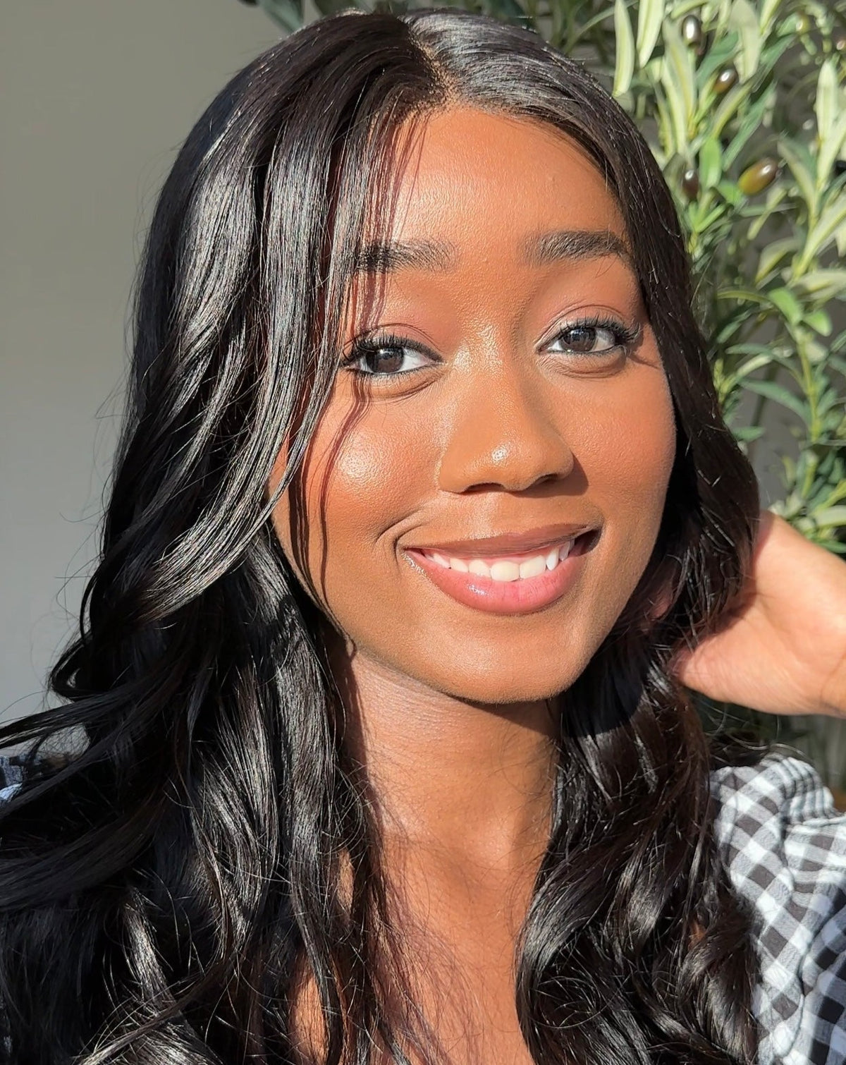 Model wearing a natural black body wave 13x4 HD lace frontal