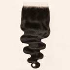 Body wave 7x7 HD lace closure in natural black, laid flat showing the full hair length