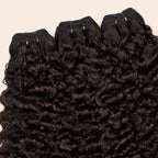 Three Burmese curly bundles angled to show the machine-sewn wefts