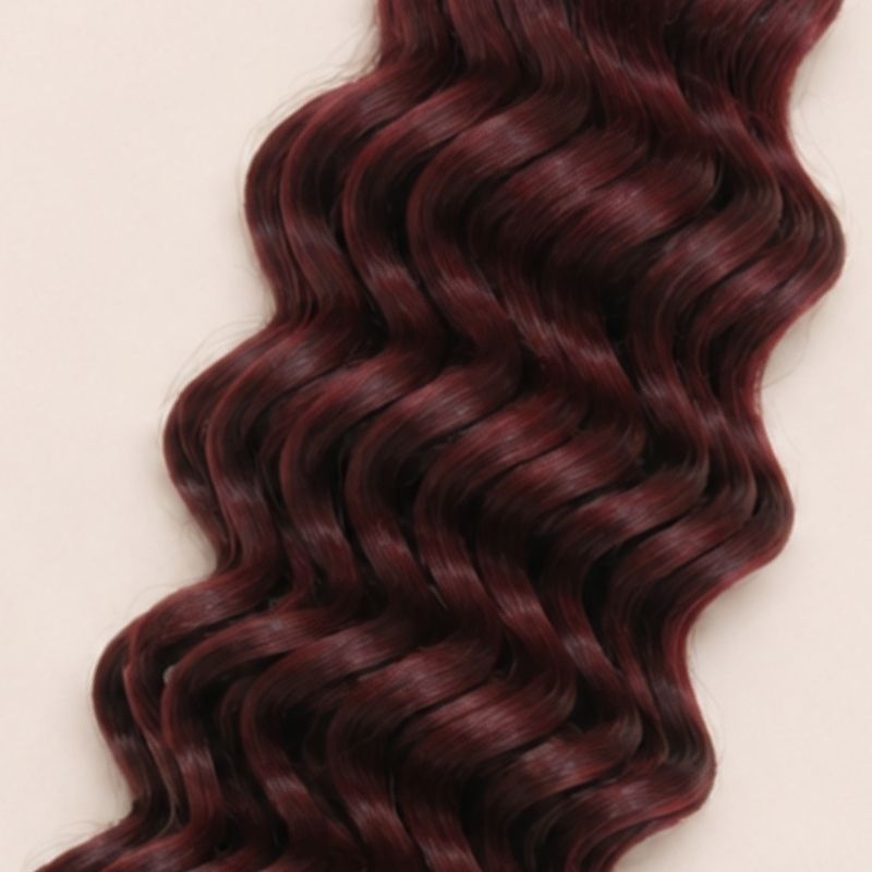Close-up of the deep wave texture in color 99J burgundy human braiding hair