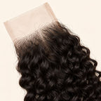 Close-up of the HD lace and parting on a curly 2x6 closure