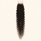 Curly 2x6 HD lace closure in natural black, laid flat showing the full hair length