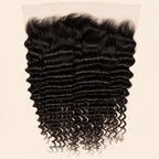 Deep wave 13x6 HD lace frontal in natural black, laid flat showing the full ear-to-ear lace