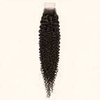 Jerry curl 2x6 HD lace closure in natural black, laid flat showing the full hair length