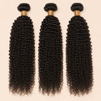 Three Jerry curl human hair bundles standing side by side