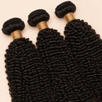 Three Jerry curl bundles angled to show the machine-sewn wefts
