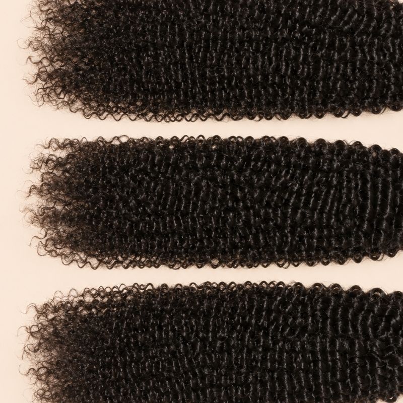 Three Jerry curl wefts laid flat, showing the staggered lengths