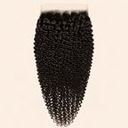 Jerry curl 7x7 HD lace closure in natural black, laid flat showing the full hair length