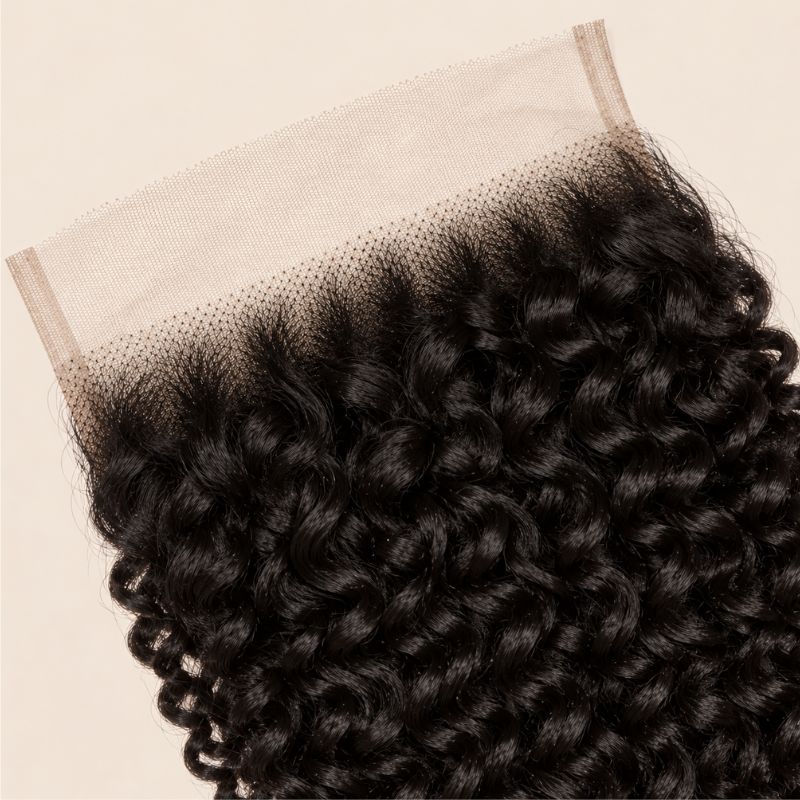 Close-up of the HD lace and parting on a kinky curly 6x6 closure