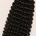 Close-up of the small, springy kinky curly pattern in natural black