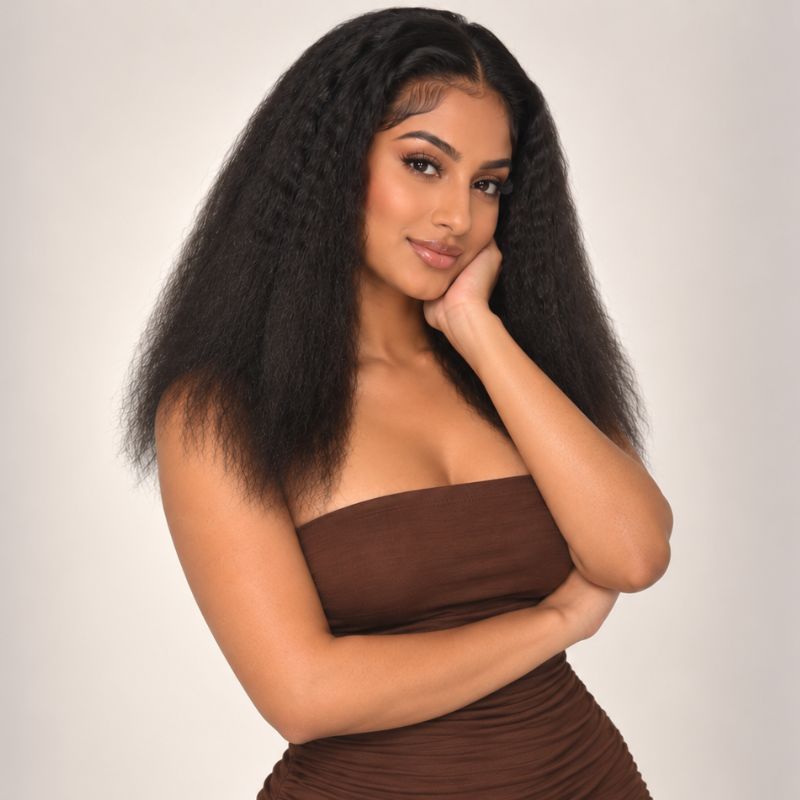 Model wearing kinky straight clip-in hair extensions