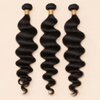 Three loose wave human hair bundles standing side by side