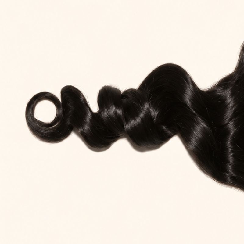 Close-up of the loose wave texture on a 6x6 HD lace closure