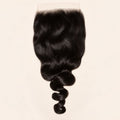 Loose wave 7x7 HD lace closure in natural black, laid flat showing the full hair length