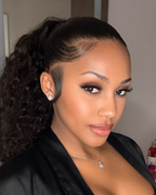 Long natural black Brazilian deep wave install styled with a side part
