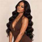 Model wearing raw body wave human hair bundles installed in a sew-in