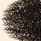 Close-up of the raw Burmese curly texture on a 13x4 HD lace frontal
