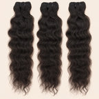 Three raw Indian curly human hair bundles standing side by side