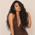 Model wearing raw Indian wavy human hair bundles installed in a sew-in
