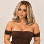 Model wearing a honey blonde raw layered flip bob wig, shown from another angle