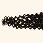 Close-up of the Spanish wave texture on a 2x6 HD lace closure