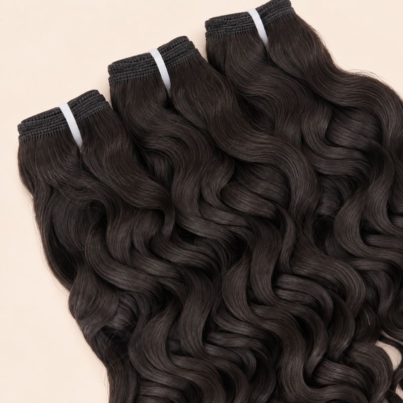 Three Spanish wave bundles angled to show the machine-sewn wefts