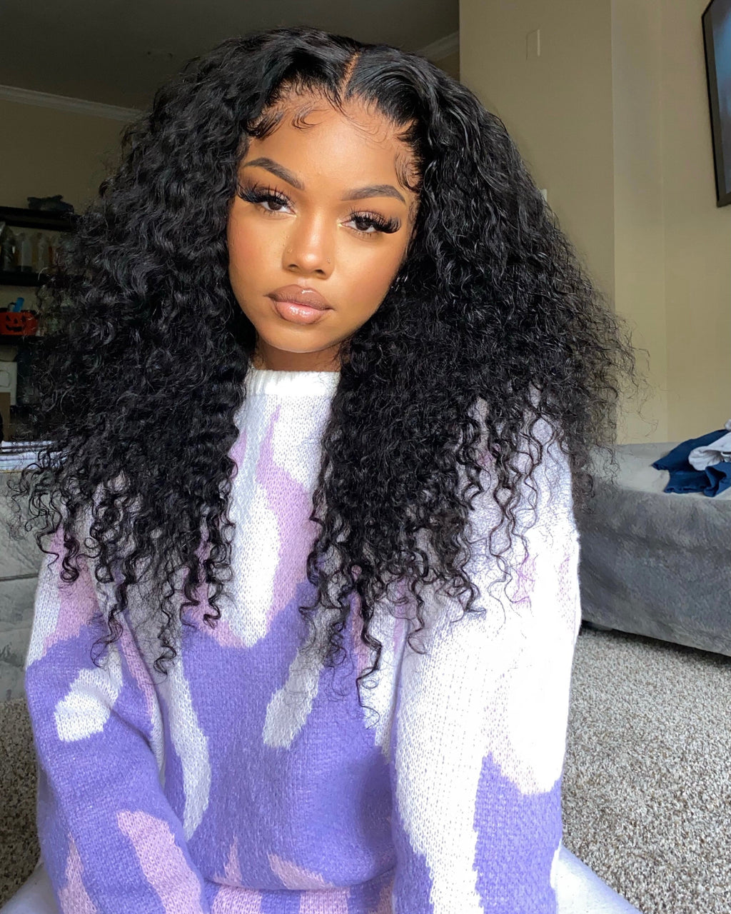 Natural black virgin Brazilian water wave bundle laid flat showing full length