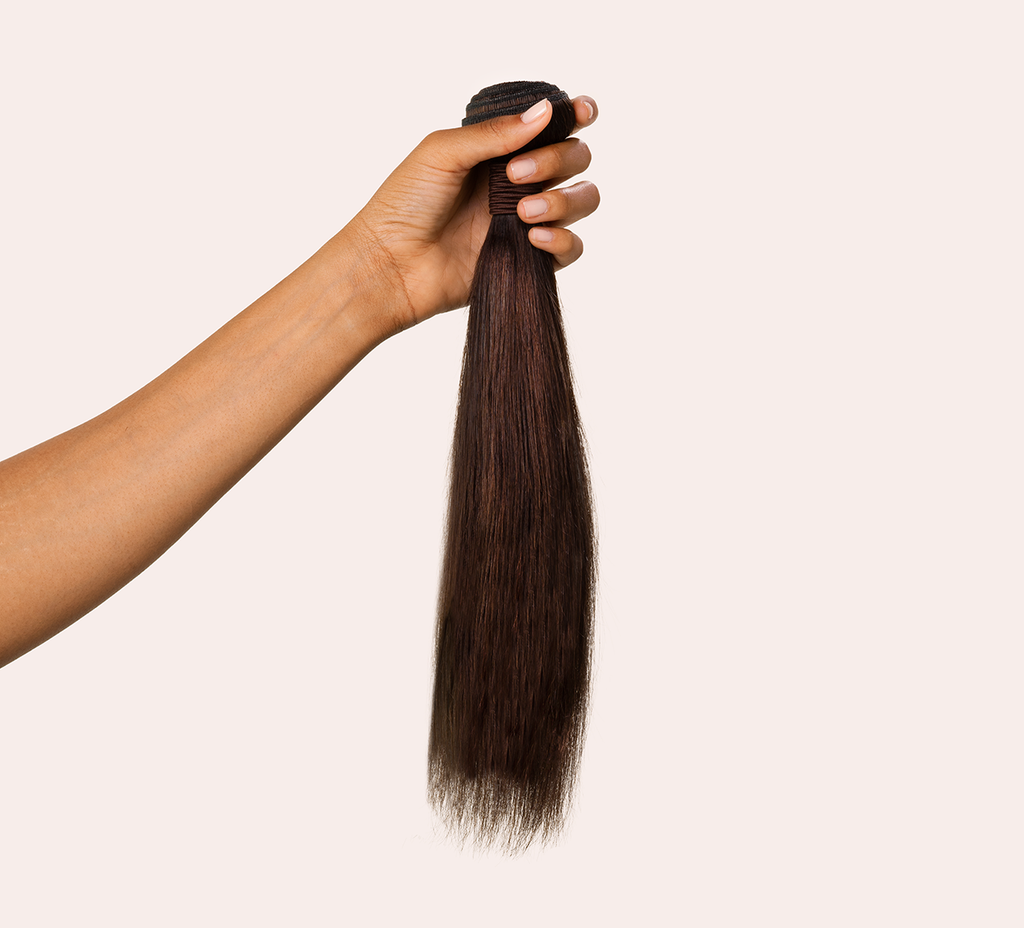 Close-up of the double machine weft on a chocolate brown straight bundle