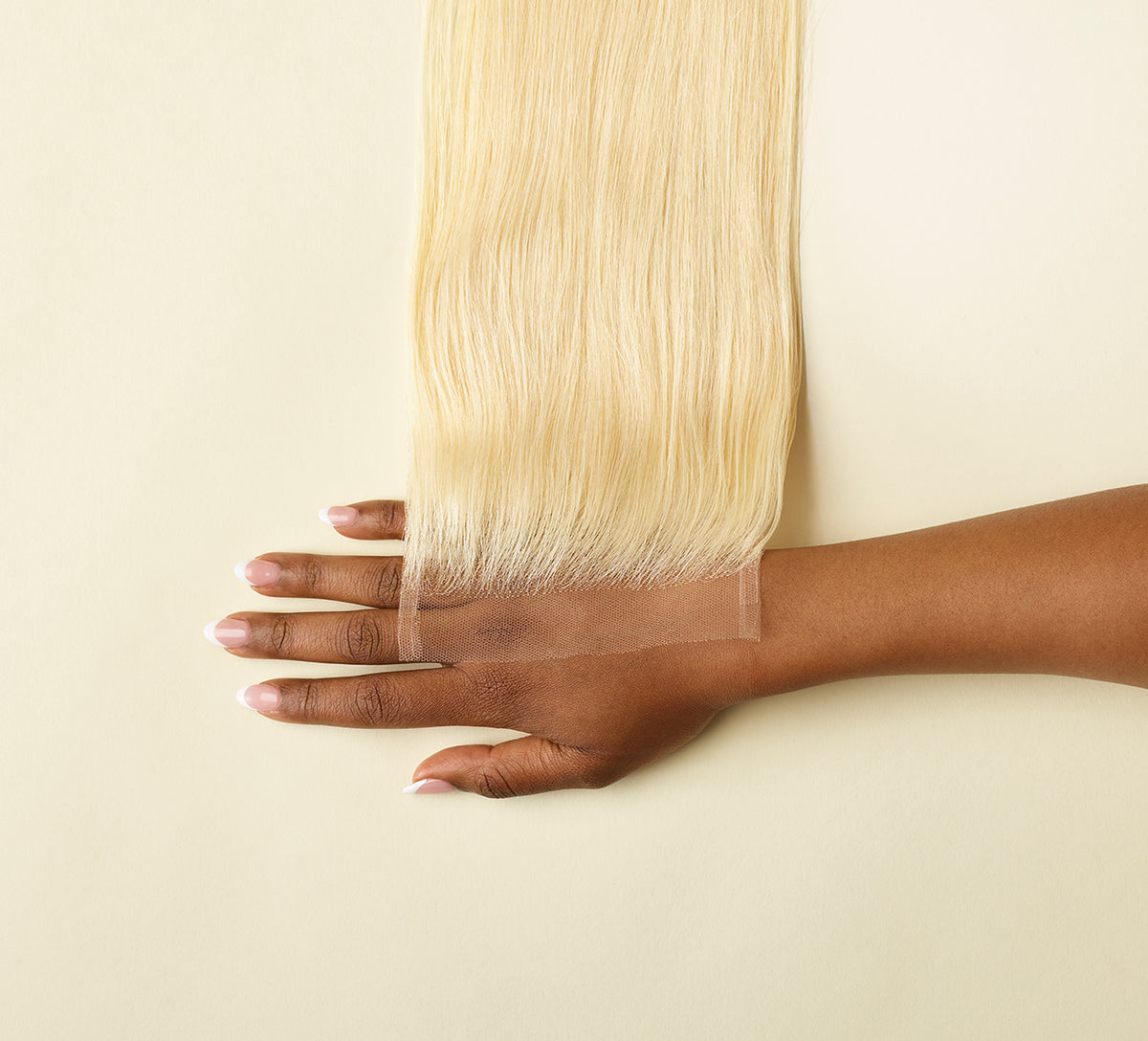 Close-up of the sheer HD lace parting on a blonde 613 closure