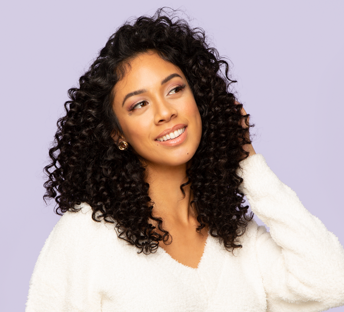 Model wearing a natural black deep wave 4x4 lace closure with middle part