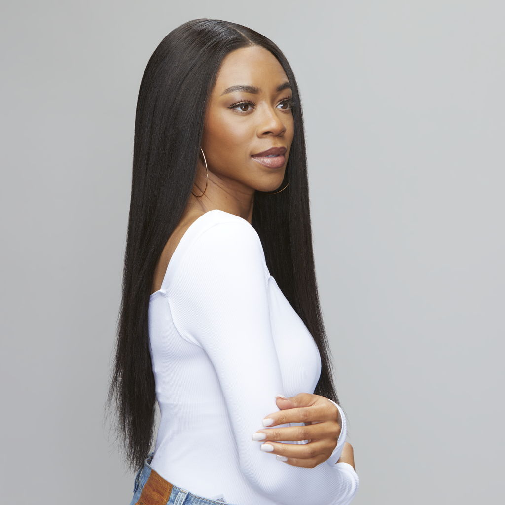 Hand holding a natural black yaki straight HD lace closure piece
