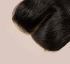 Close-up of transparent lace on a jet black loose wave closure