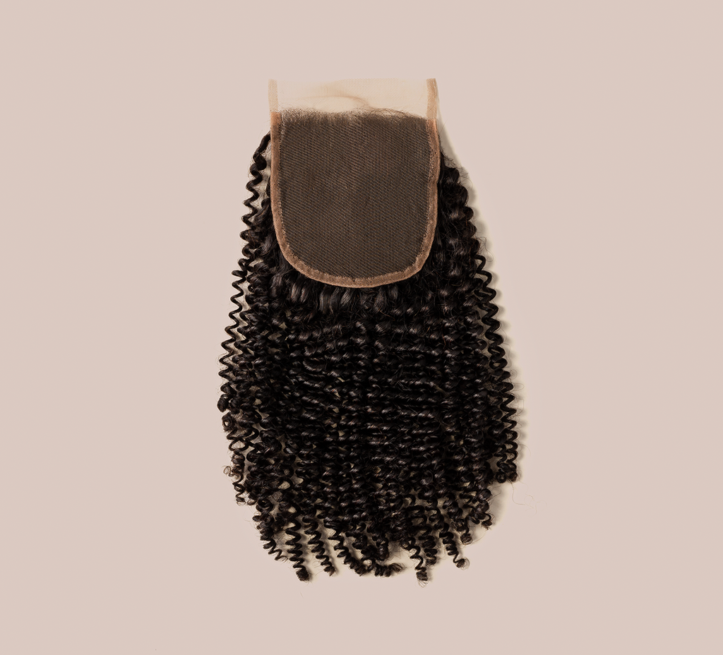 Color swatch of natural black virgin Brazilian curly 4x4 closure hair