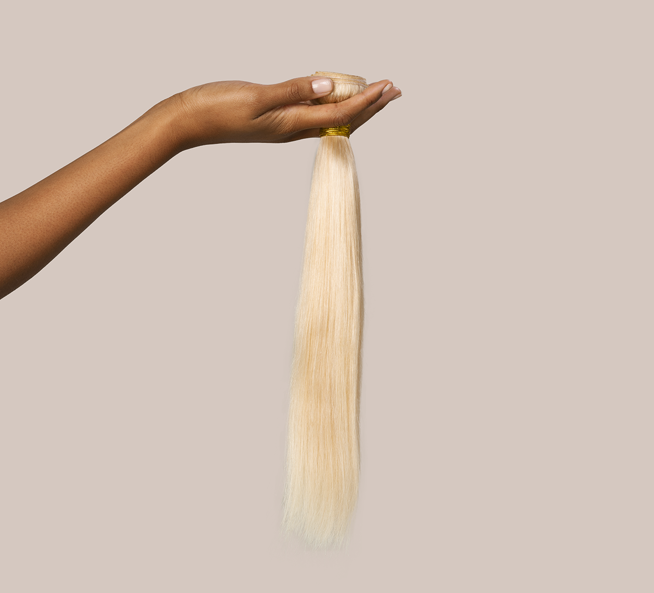Three 613 blonde Indian straight bundles stacked for a full sew-in