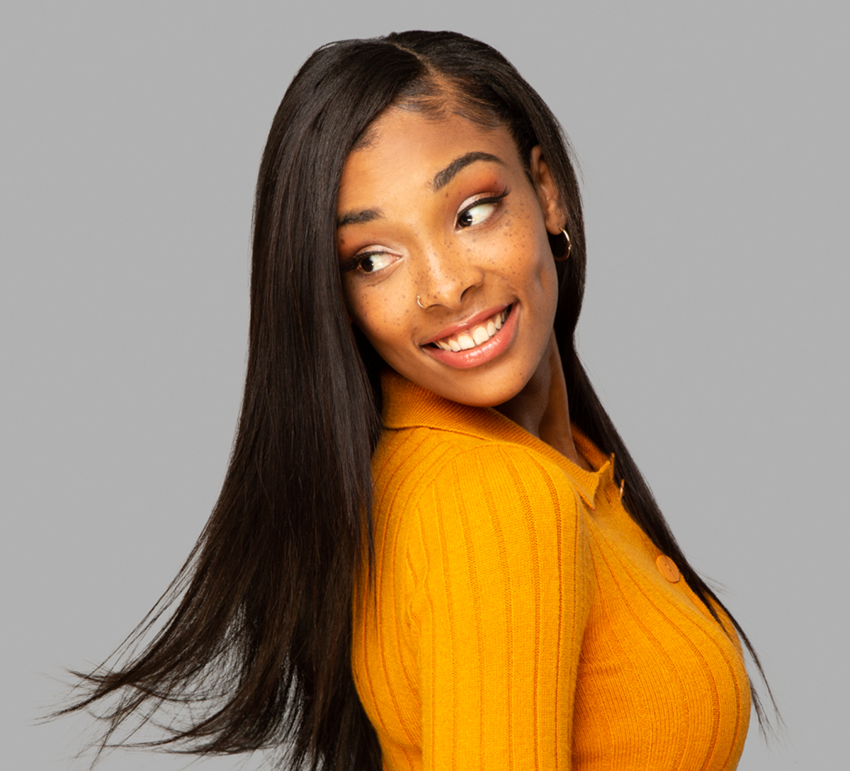 Model wearing a natural black Brazilian straight 13x4 transparent lace frontal