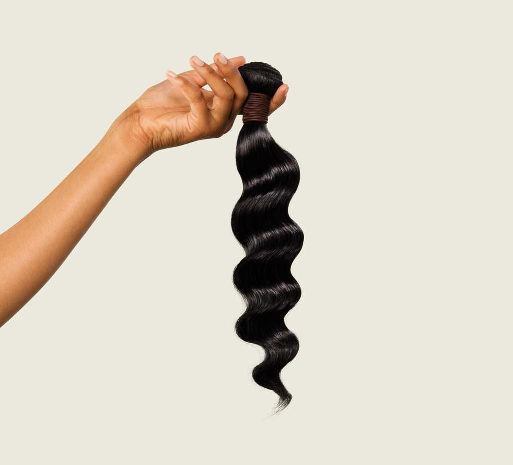 Close-up of the relaxed wave pattern on jet black virgin hair