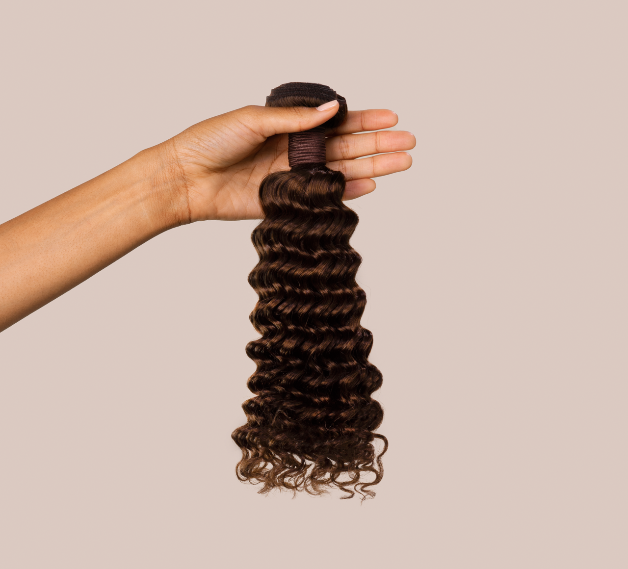 Close-up of the deep wave curl pattern on chocolate brown virgin hair