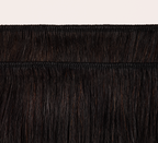 Back view of a Brazilian deep wave sew-in showing dense curl definition