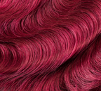 Back view of a 99J burgundy body wave sew-in showing deep red tone