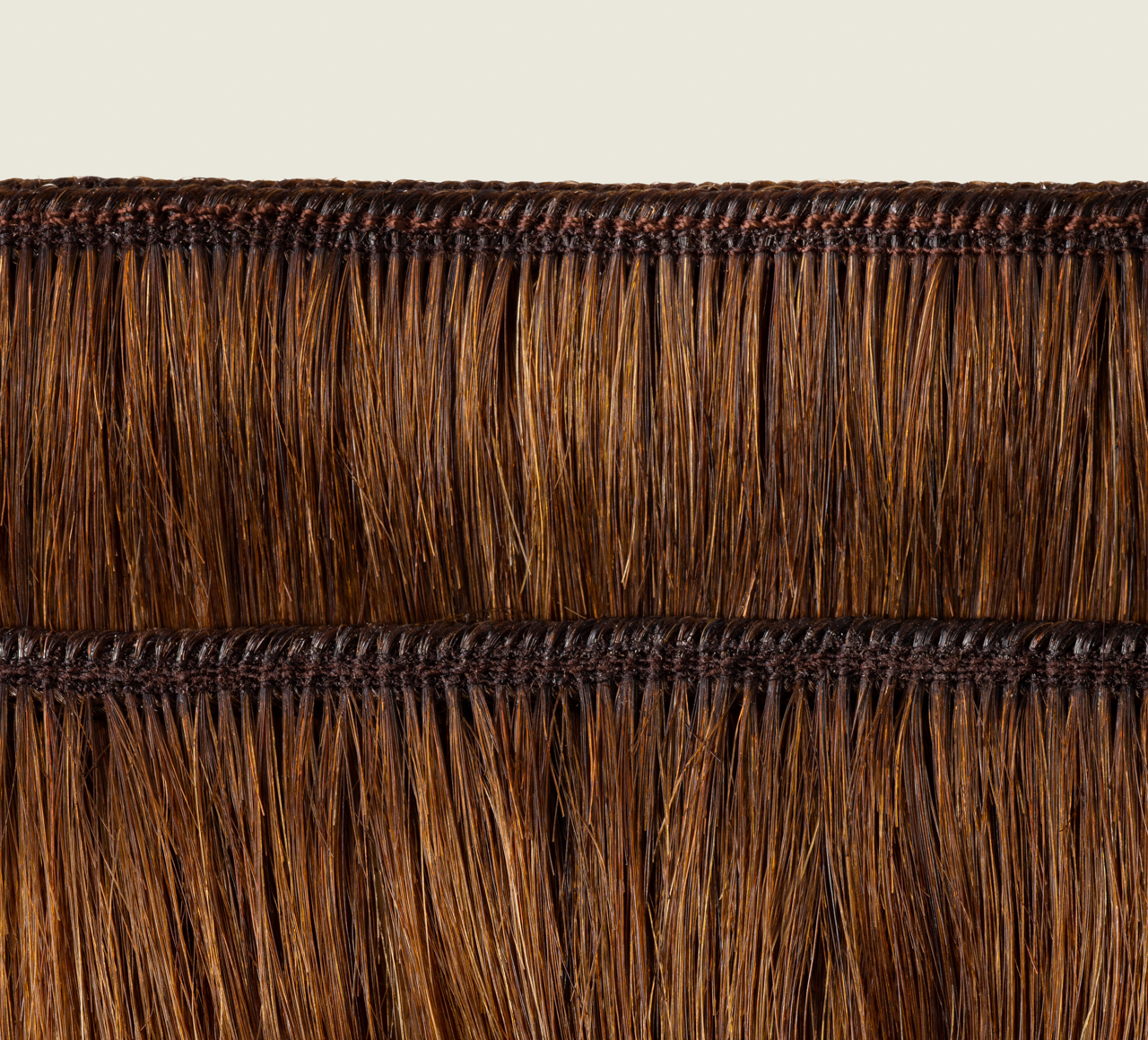 Side view of a caramel brown body wave install past the shoulder