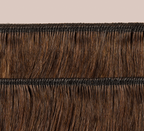 Side view of a chocolate brown loose wave install past the shoulder