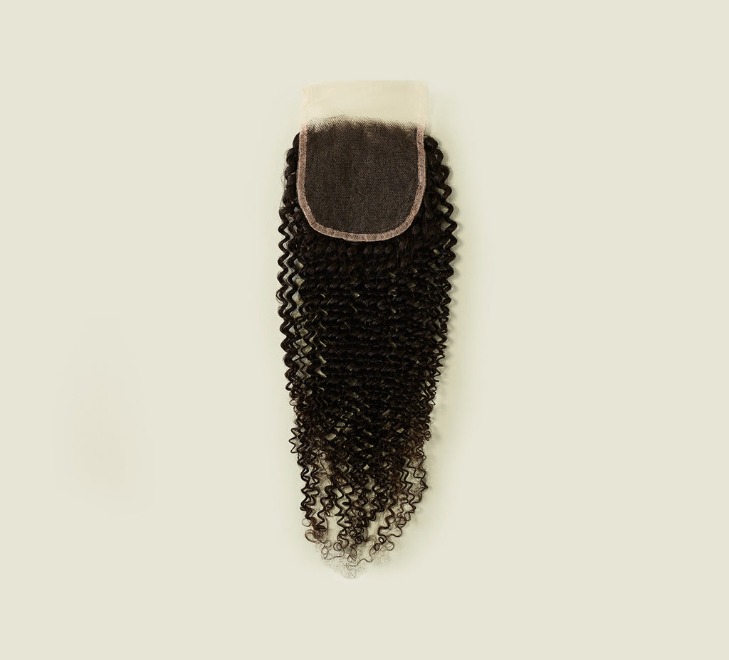 Color swatch of natural black virgin Brazilian curly HD closure hair