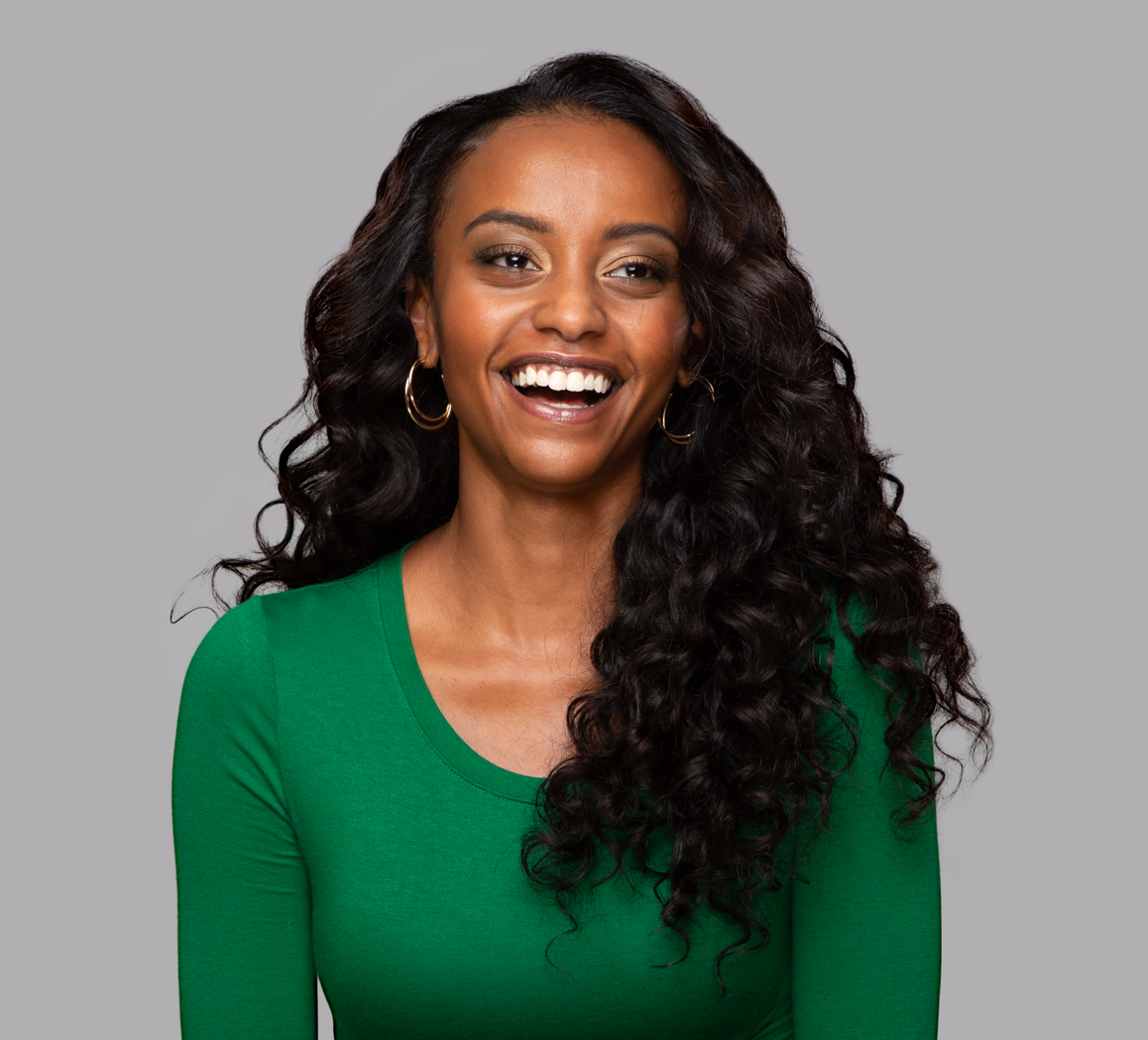 Model wearing a natural black Brazilian loose wave sew-in, front view