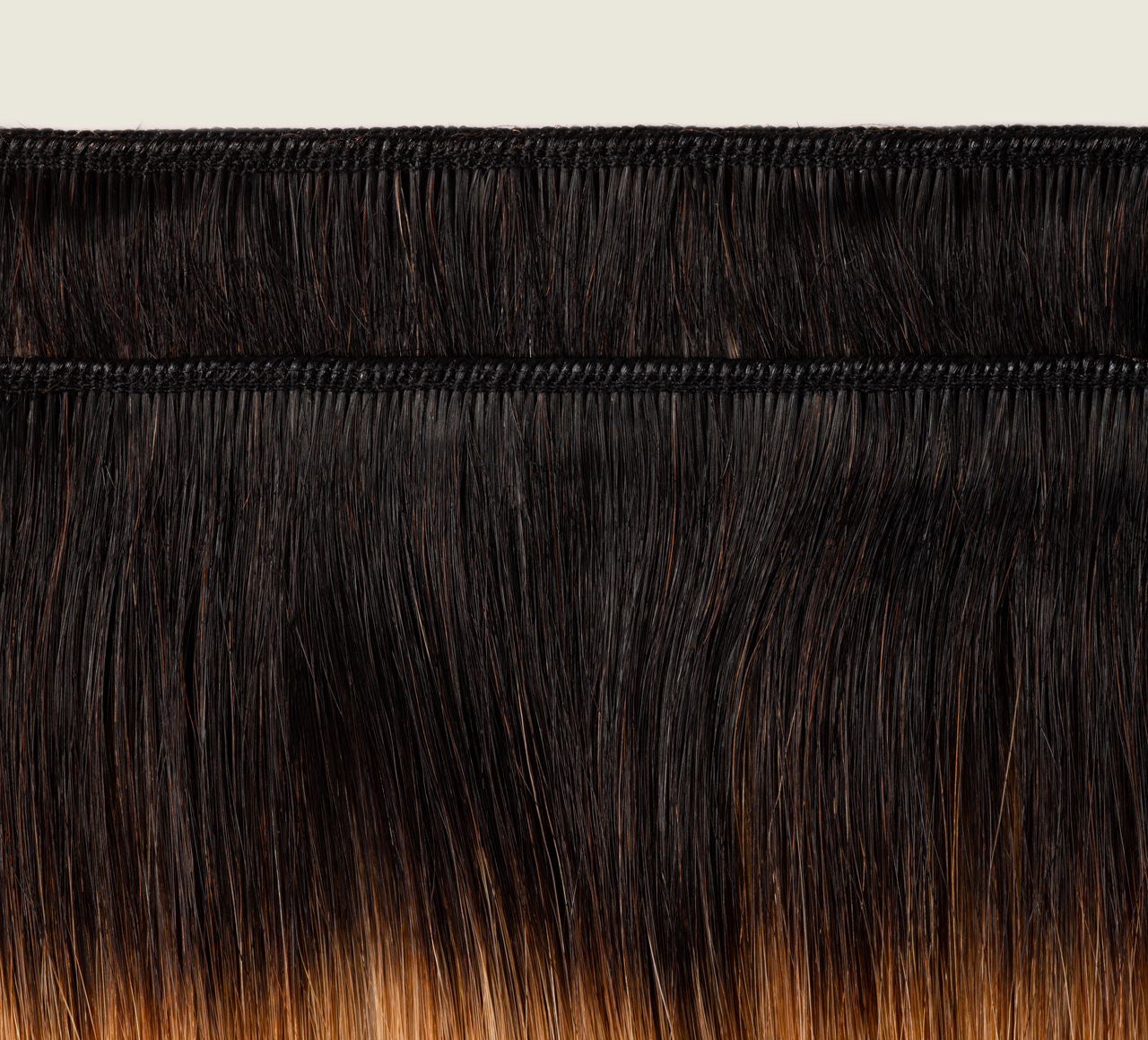 Back view of a 1B/27 honey blonde rooted Indian straight install