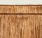 Back view of a 27 honey blonde Indian straight install styled sleek