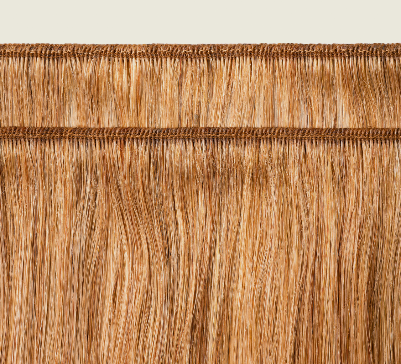 Back view of a 27 honey blonde Indian straight install styled sleek