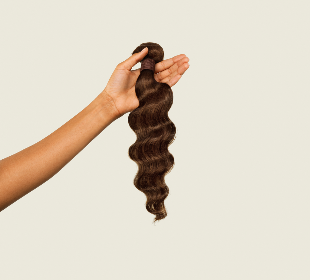 Close-up of the relaxed wave pattern on chocolate brown virgin hair