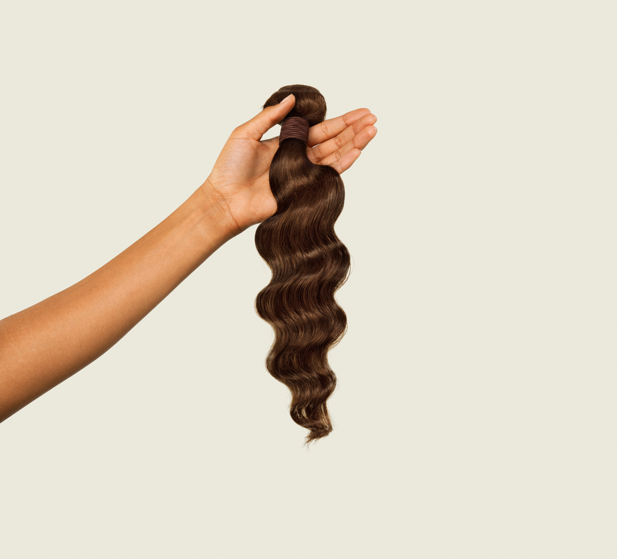 Close-up of the relaxed wave pattern on chocolate brown virgin hair